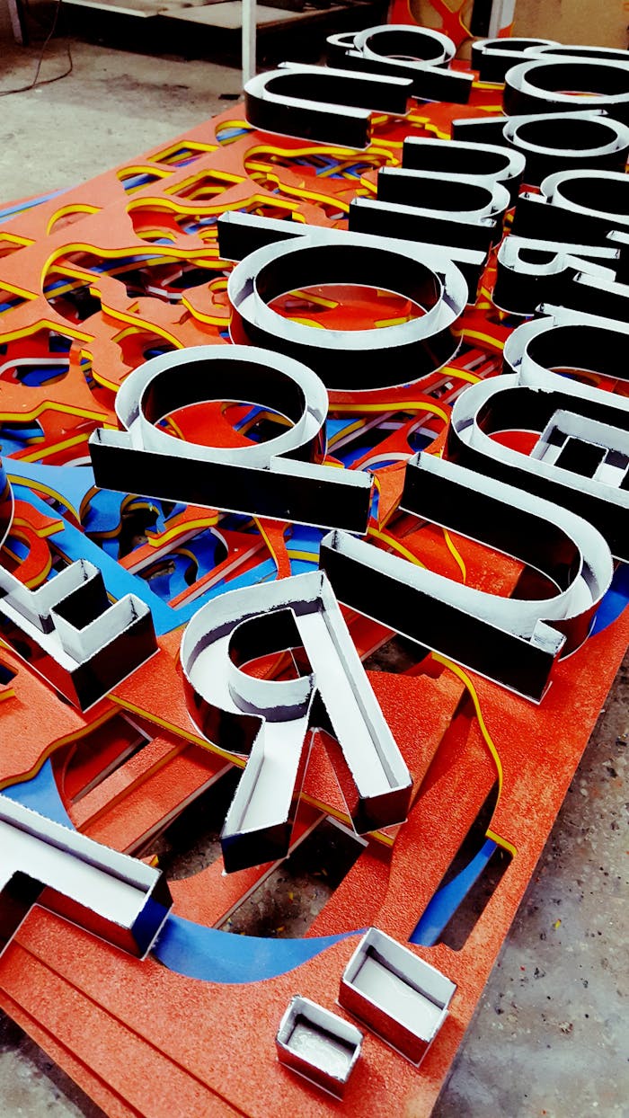 services-02 Vibrant neon letters arranged artistically, showcasing a unique signage design.